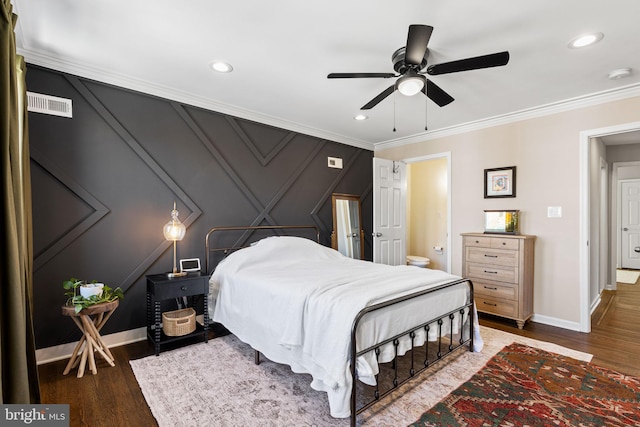 bedroom featuring wood finished floors, baseboards, and ornamental molding