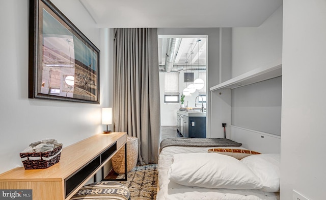 bedroom featuring a sink