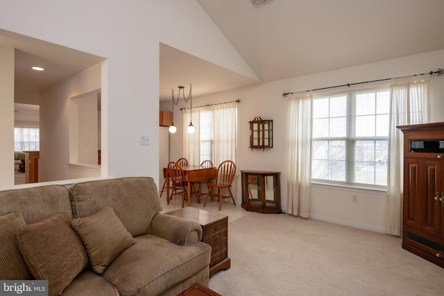 living area with lofted ceiling, light carpet, baseboards, and recessed lighting