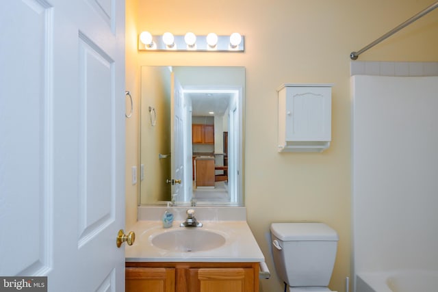 bathroom with vanity and toilet