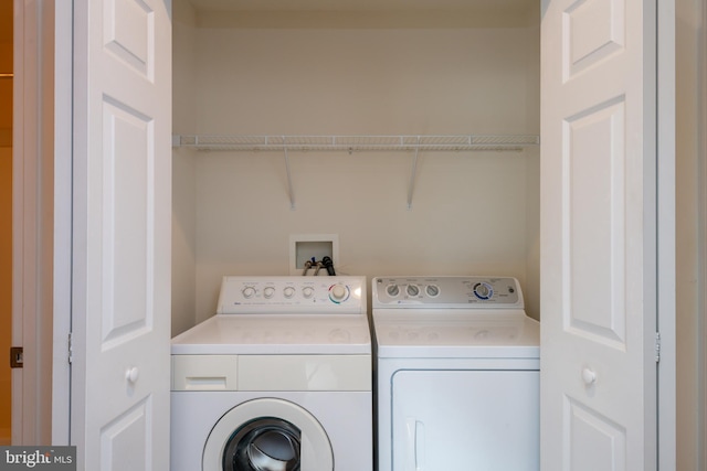 laundry room with laundry area and separate washer and dryer