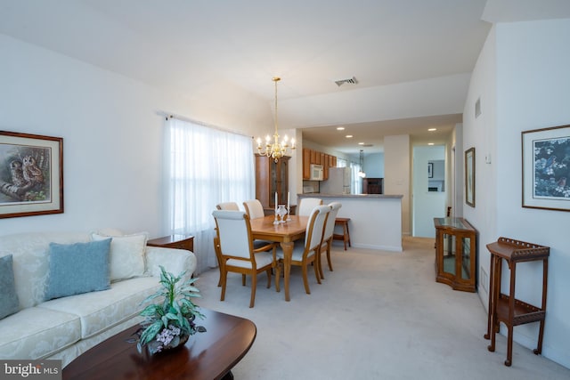 dining area with recessed lighting, an inviting chandelier, visible vents, and light colored carpet