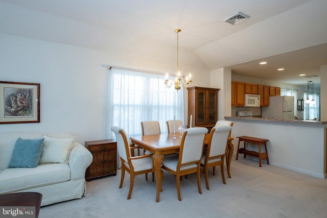 dining space featuring a notable chandelier, recessed lighting, visible vents, light carpet, and vaulted ceiling