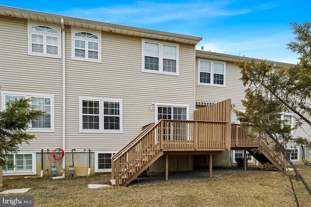 back of house with stairs and a wooden deck