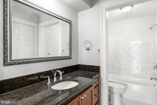 bathroom featuring shower / tub combination, vanity, and toilet