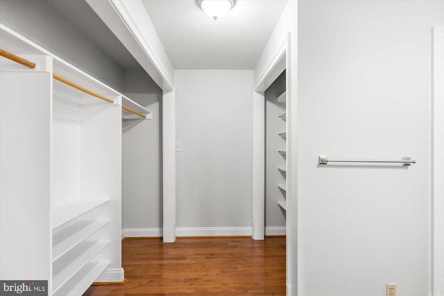 spacious closet with wood finished floors