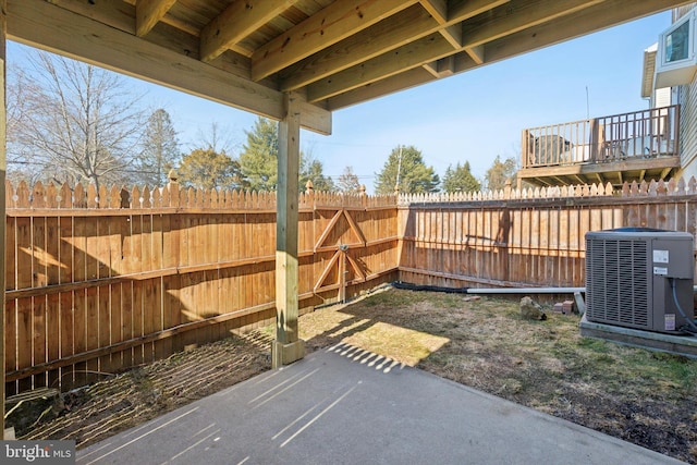 view of patio / terrace with a fenced backyard and cooling unit