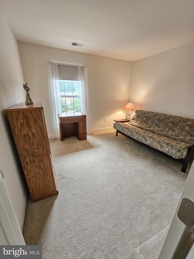 sitting room featuring carpet, visible vents, and baseboards