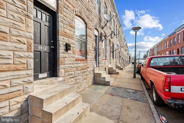 exterior space with stone siding