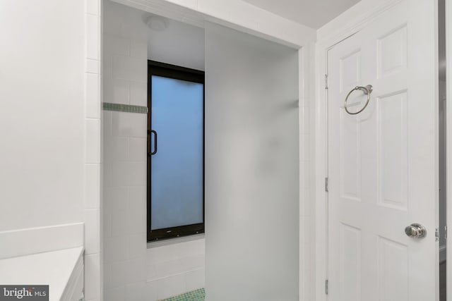 full bath with an enclosed shower