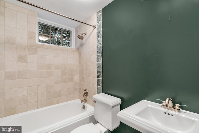 full bathroom featuring a sink, toilet, and washtub / shower combination