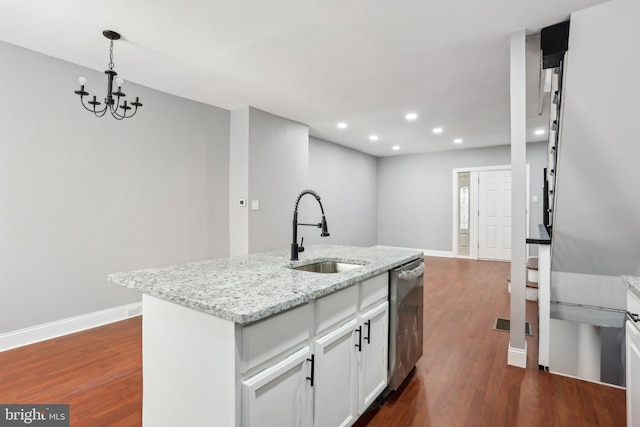 kitchen featuring stainless steel dishwasher, dark wood-type flooring, a sink, and baseboards