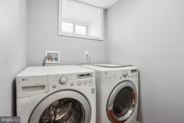 laundry area featuring washer and dryer and laundry area