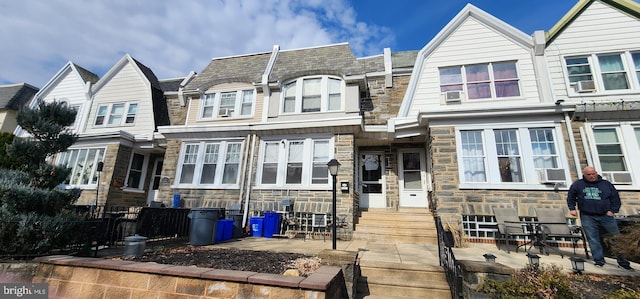 view of property with stone siding