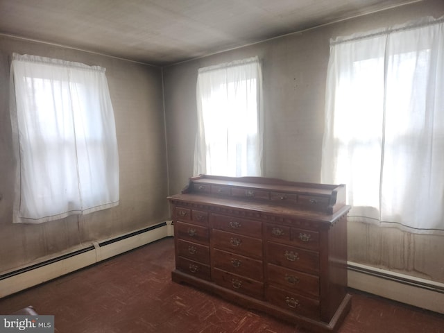 bedroom with a baseboard heating unit