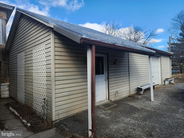 view of side of home featuring a garage