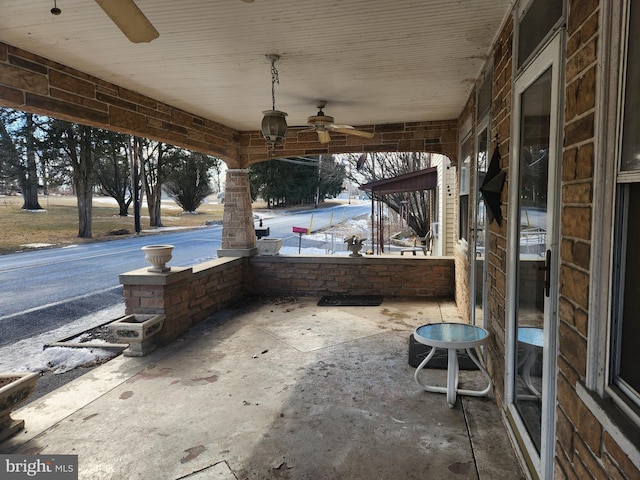 view of patio featuring covered porch and a ceiling fan