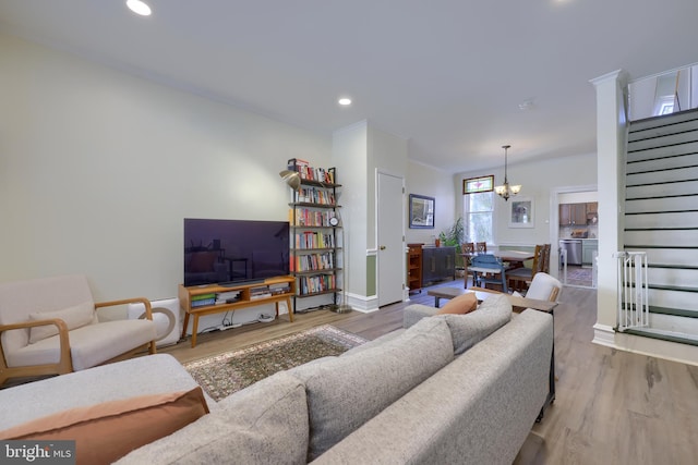 living area featuring stairs, recessed lighting, and wood finished floors