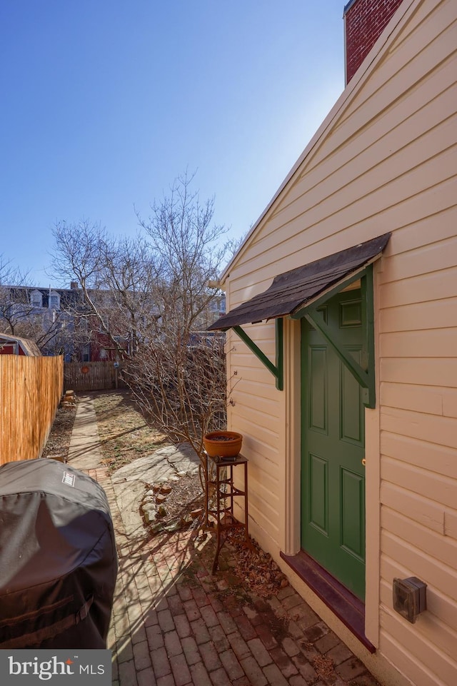 view of patio featuring fence and grilling area