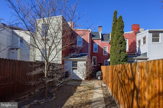 back of property with fence