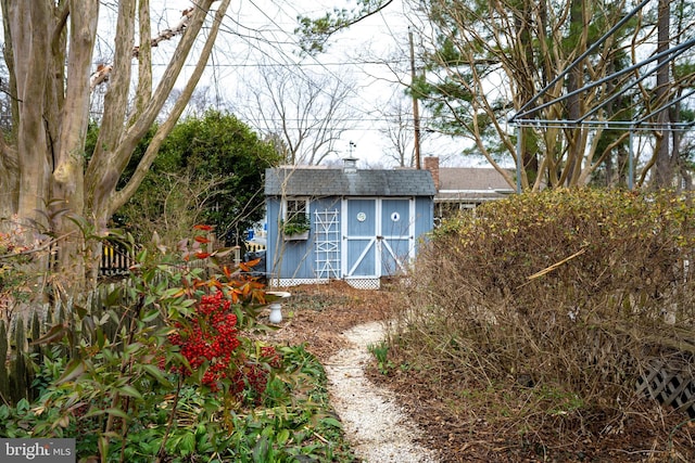 exterior space with an outdoor structure and a storage shed