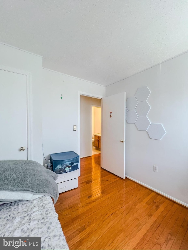 bedroom featuring light wood finished floors