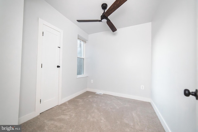 unfurnished bedroom with a ceiling fan, baseboards, and carpet flooring