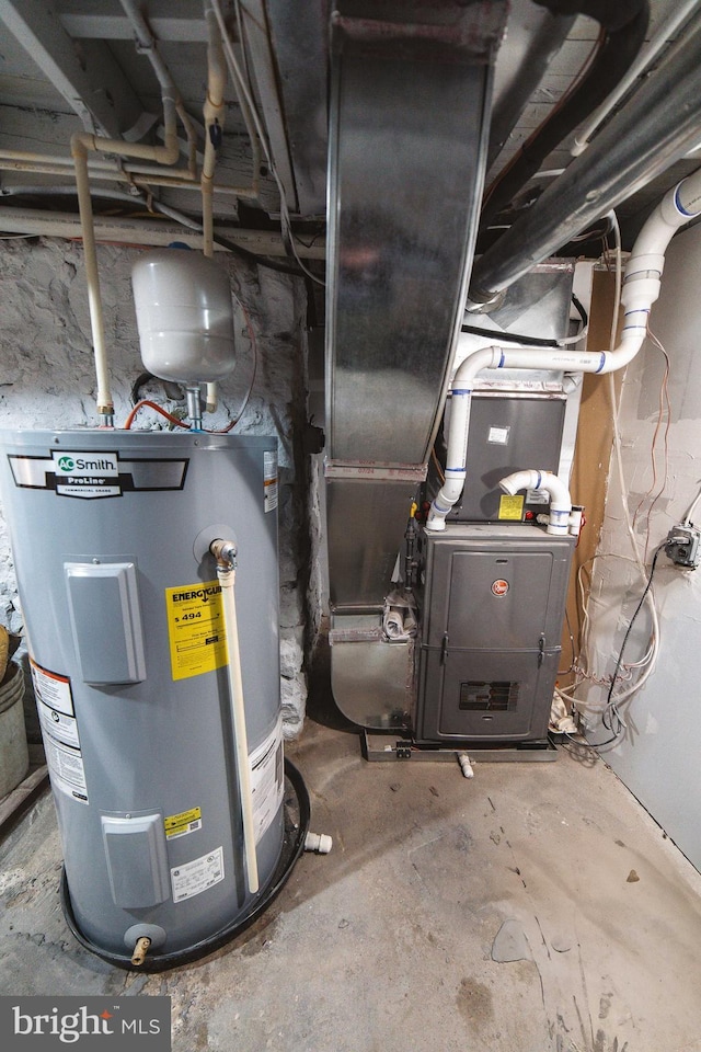 utility room featuring water heater