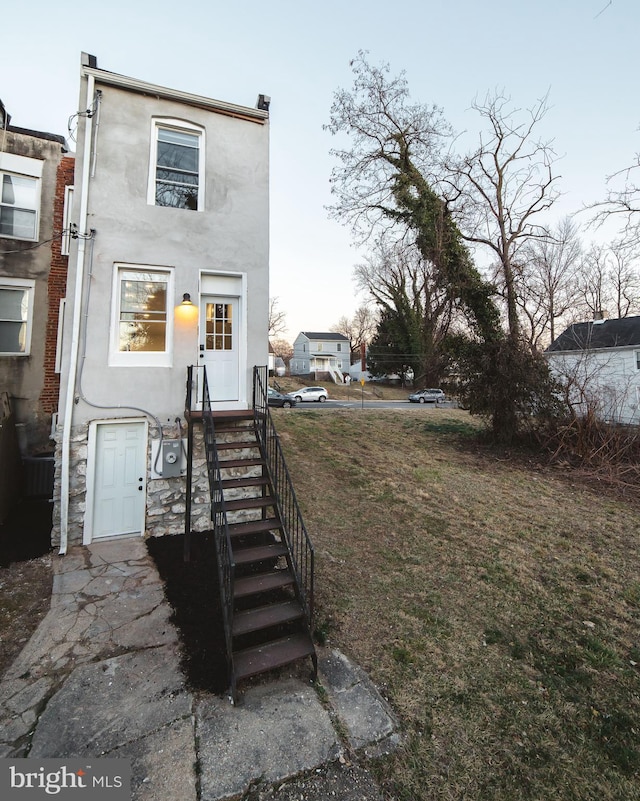 view of front of house featuring stucco siding