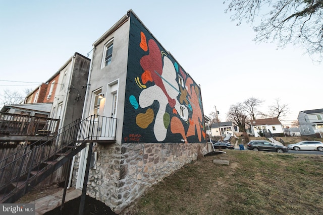 view of side of home featuring stucco siding