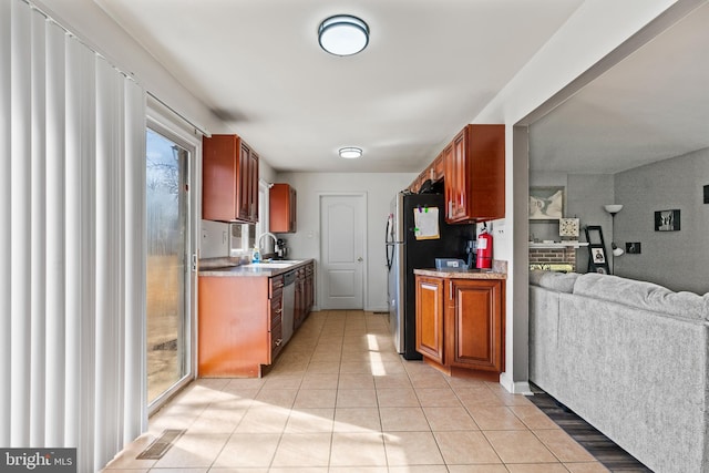 kitchen with light countertops, open floor plan, visible vents, and light tile patterned flooring