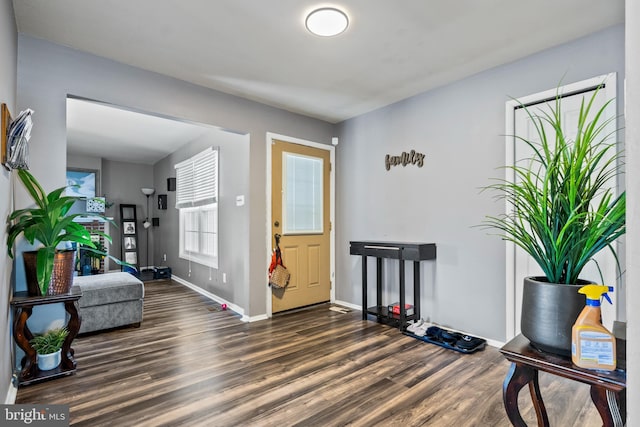 entrance foyer with wood finished floors and baseboards