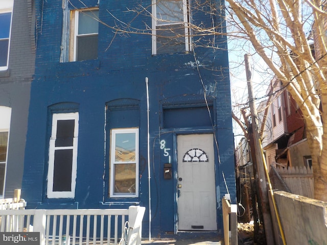 view of front of home with fence