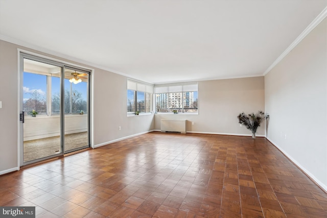 unfurnished room featuring ornamental molding and baseboards