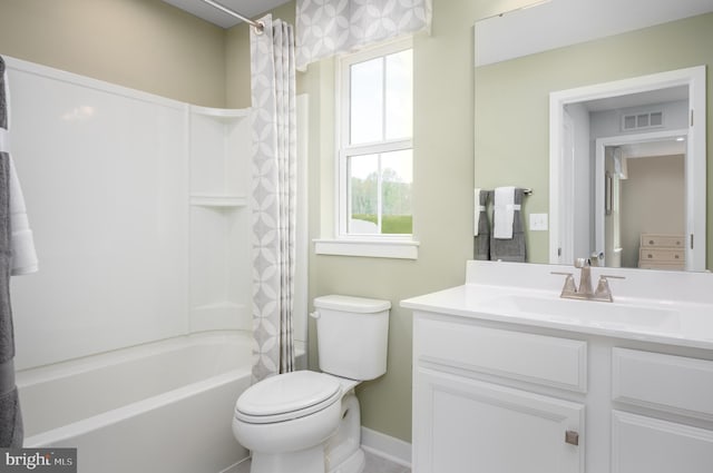 bathroom featuring toilet, vanity, visible vents, baseboards, and shower / bath combination with curtain