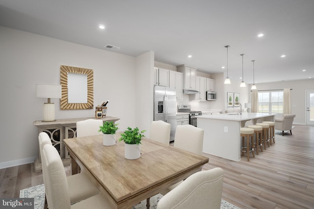 dining area featuring recessed lighting, visible vents, light wood-style flooring, and baseboards