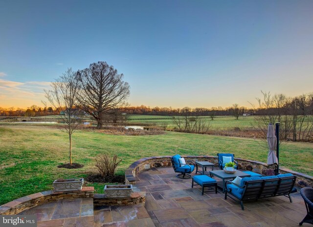 view of patio / terrace with a rural view