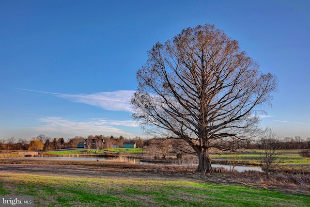 surrounding community with a water view