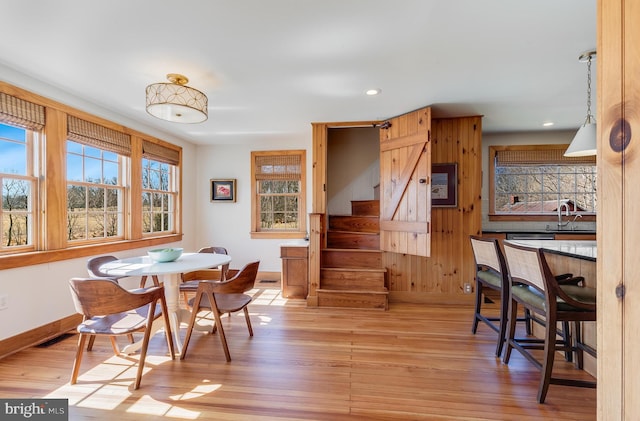 dining room with recessed lighting, visible vents, stairway, light wood-style flooring, and baseboards