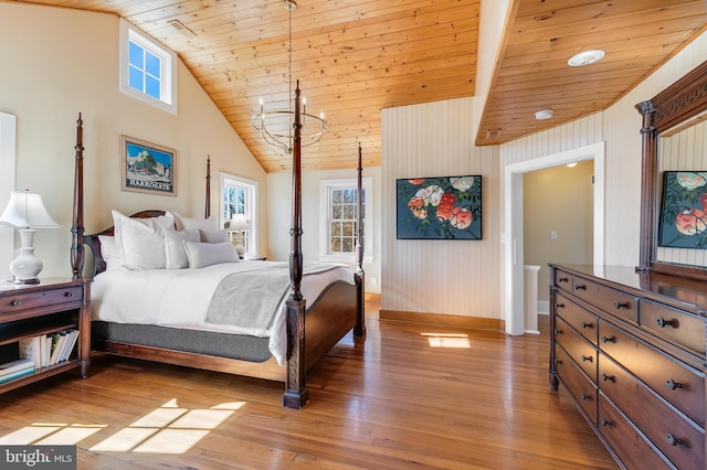 bedroom with light wood-style floors, wood ceiling, high vaulted ceiling, and a notable chandelier