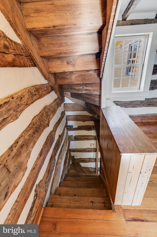 staircase featuring hardwood / wood-style flooring