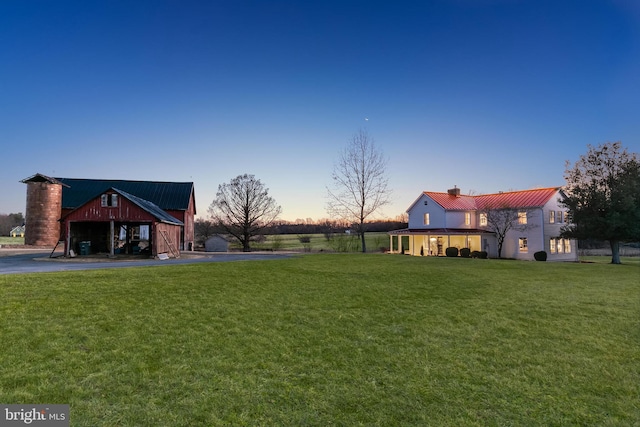 yard at dusk with an outdoor structure