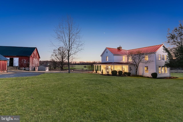 yard at dusk with an outbuilding