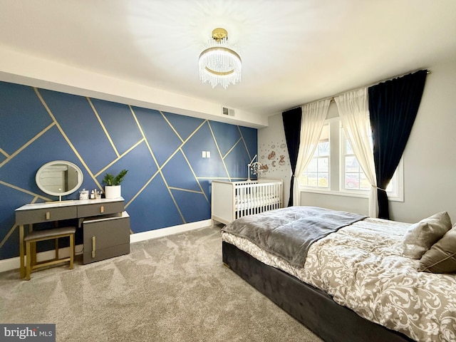 bedroom featuring baseboards, visible vents, and carpet flooring