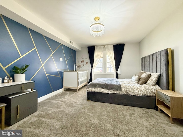 bedroom with visible vents and carpet flooring