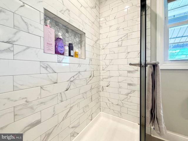 full bath featuring a tile shower