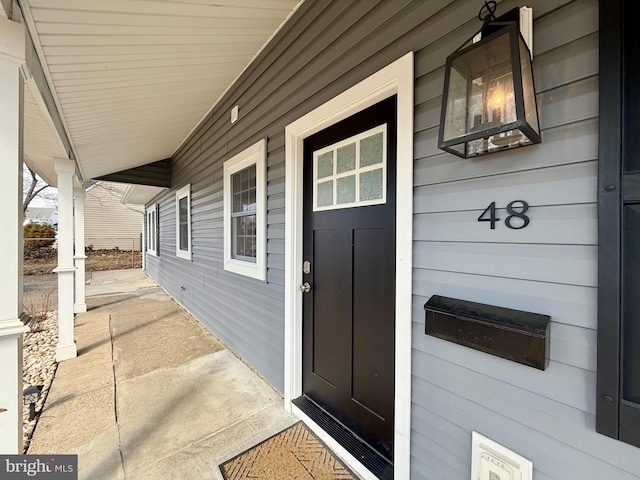 doorway to property with a porch