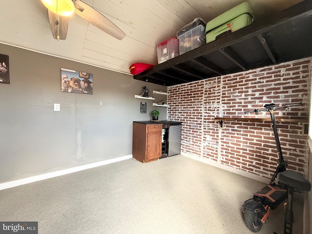 interior space with wood ceiling, baseboards, and brick wall