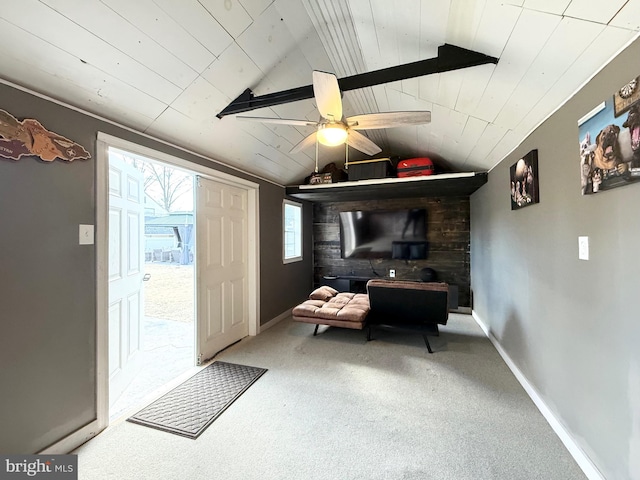 interior space with vaulted ceiling with beams, wooden ceiling, carpet, and baseboards