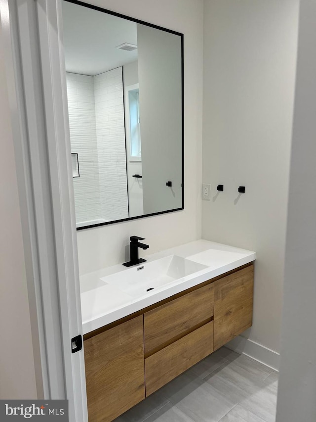 bathroom featuring visible vents and vanity